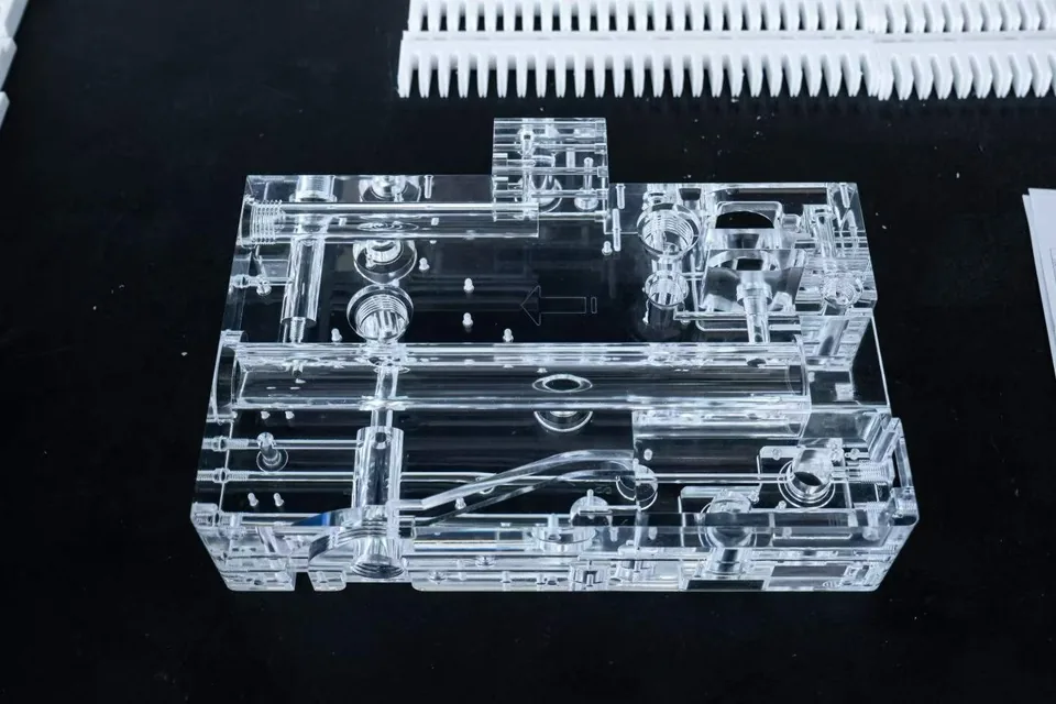 Precision machined acrylic microfluidic component for medical and laboratory applications